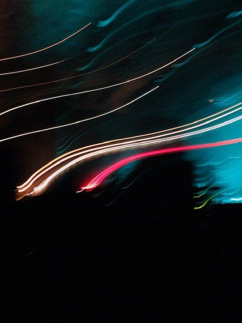 A blurry picture of a light trail in the dark