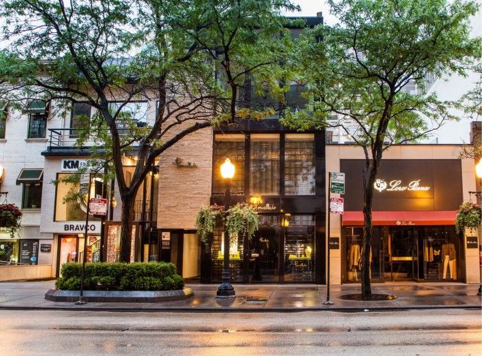 A row of stores are lined up on a city street