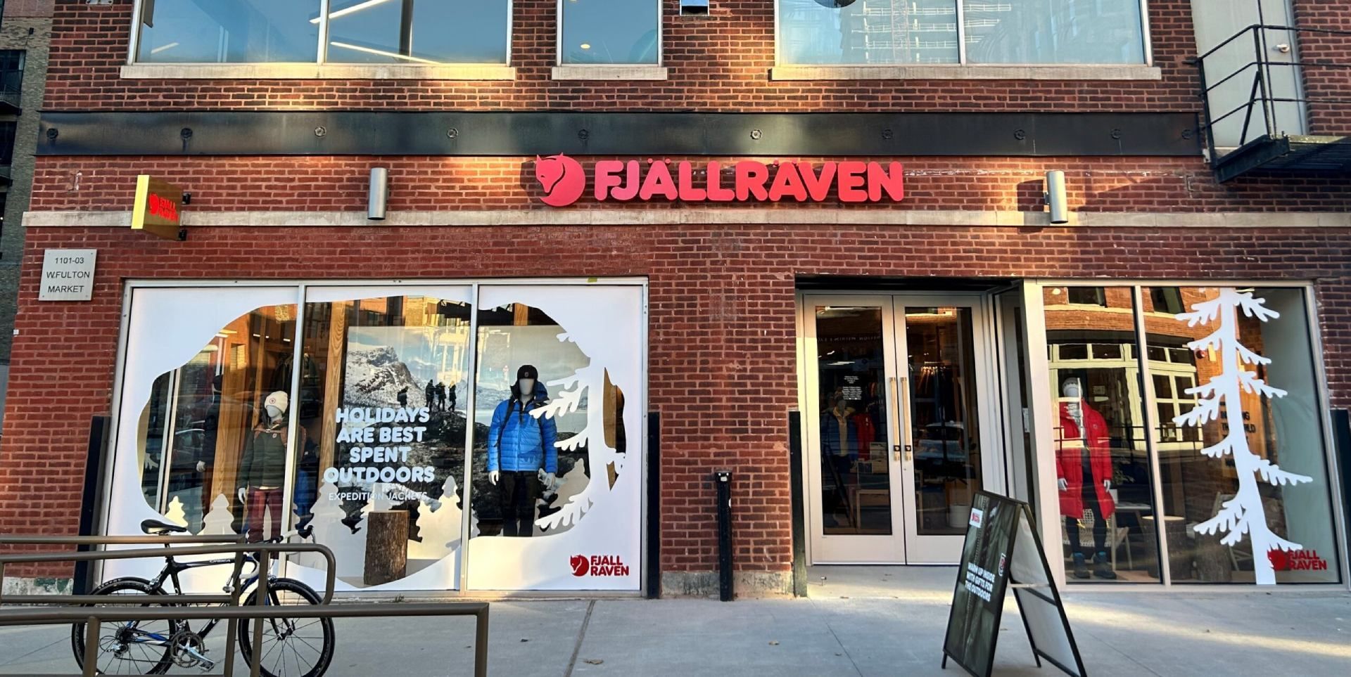 A brick building with a sign that says fjällraven on it.