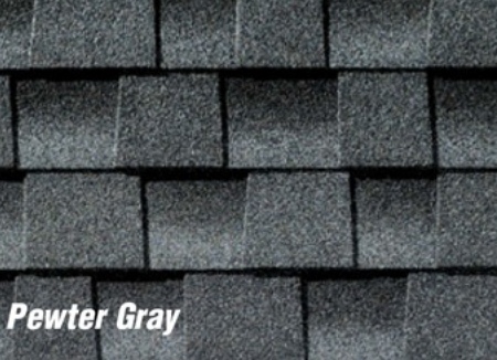 A close up of pewter gray shingles on a roof