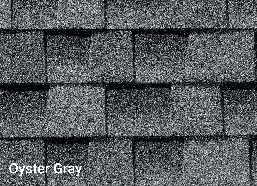 A close up of a roof with oyster gray shingles.