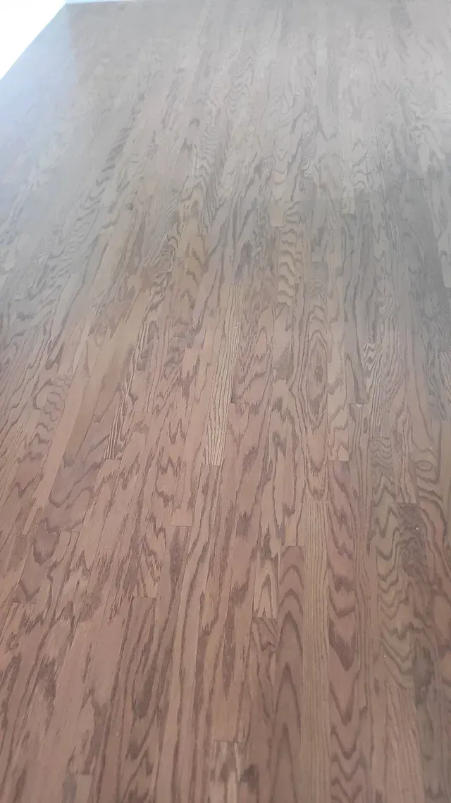 Brown wooden surface with visible grain patterns.