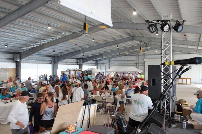 A large group of people are gathered in a large building