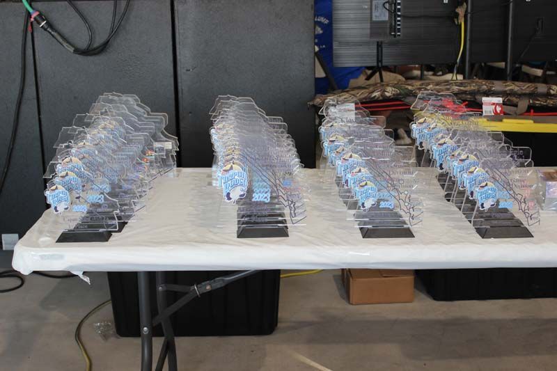 A table with a lot of trophies on it