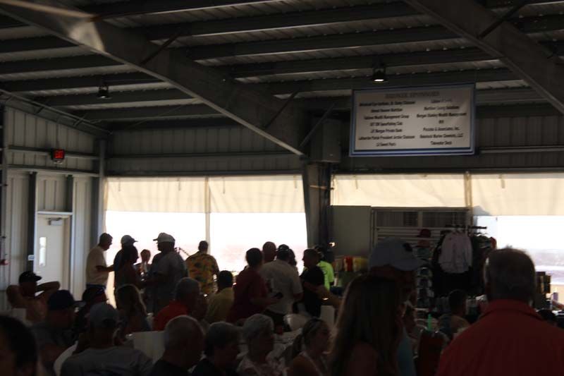 A large group of people are gathered inside a building