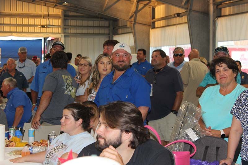 A large group of people are gathered in a room.