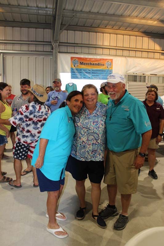A group of people are posing for a picture in a room.