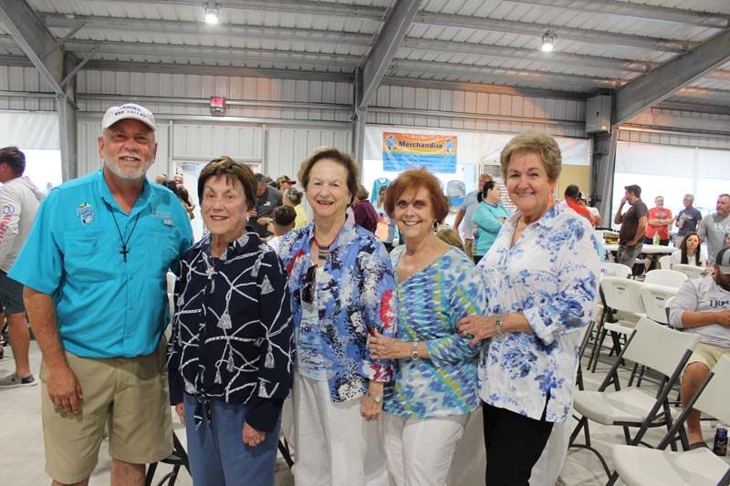 A group of people posing for a picture in a room