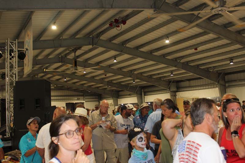 A large group of people are gathered in a large room.