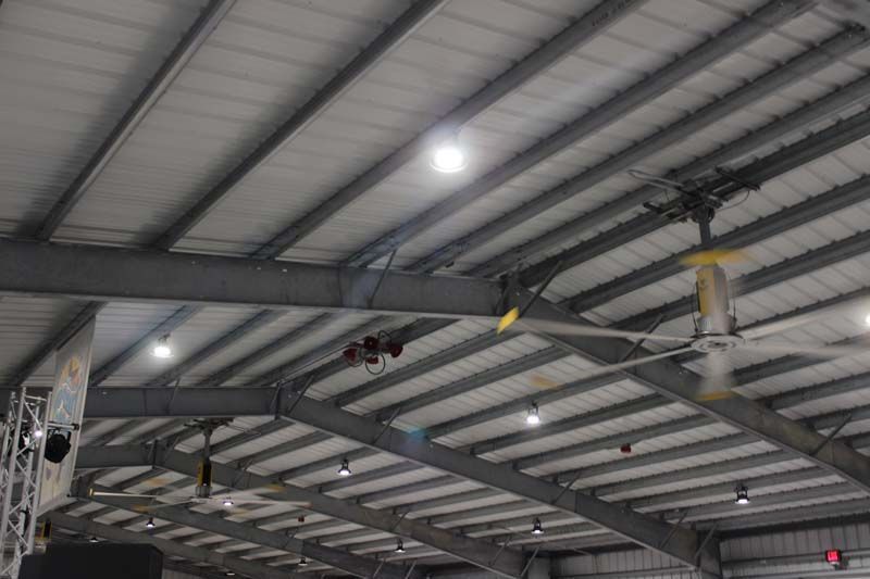 A ceiling fan is hanging from the ceiling of a building.