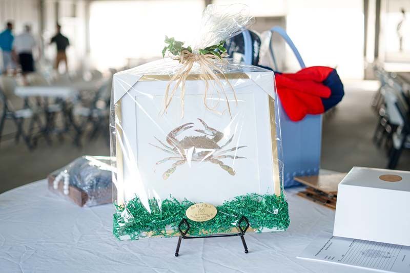 A picture of a crab is wrapped in plastic and sitting on a table.