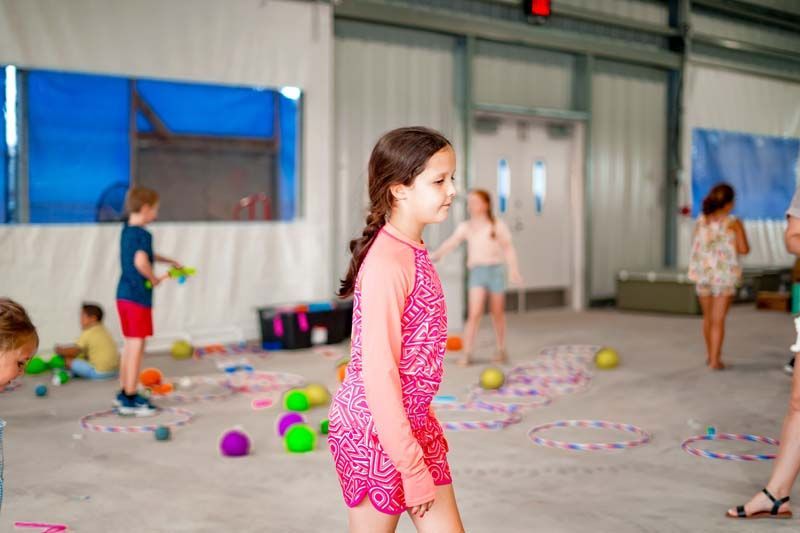 A group of children are playing with toys in a room.