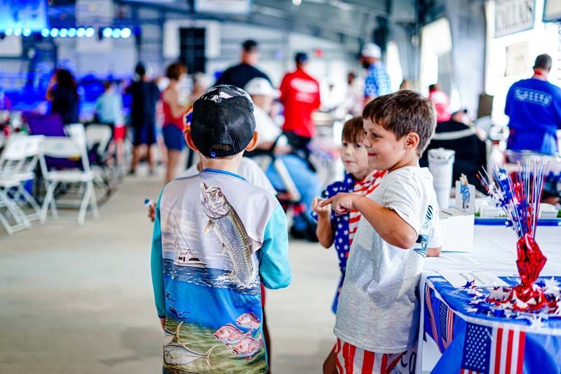 A group of young boys are standing next to each other in a room.