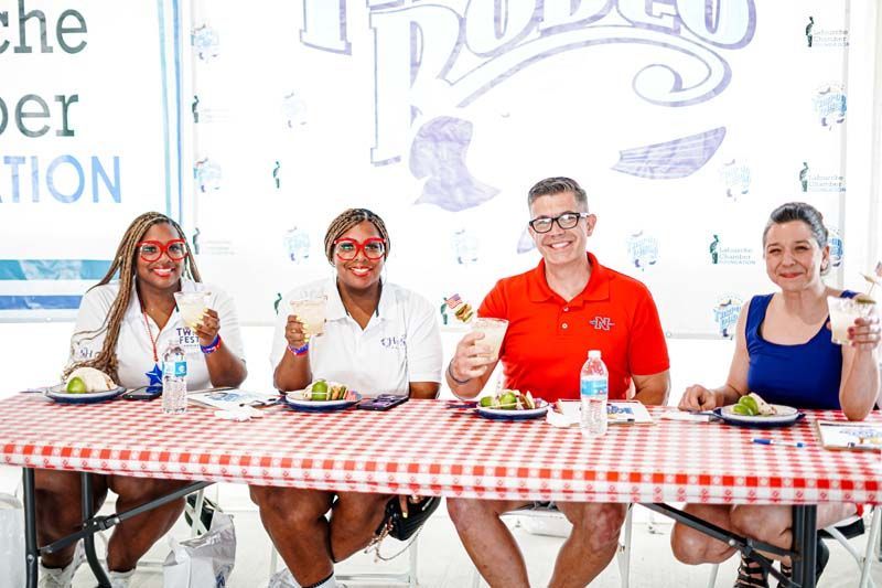 A group of people are sitting at a table eating food.