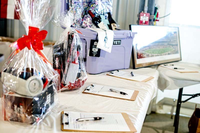 A table with a basket and a cooler on it.