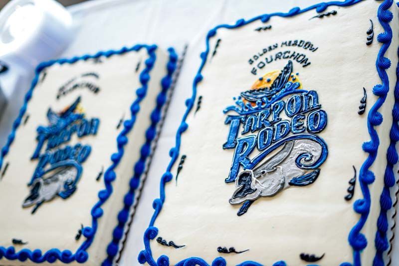 Two cakes with blue frosting and a logo that says four seasons rodeo