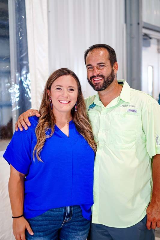 A man and a woman are posing for a picture together.