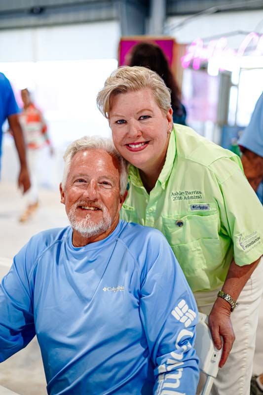 A man and a woman are posing for a picture together.