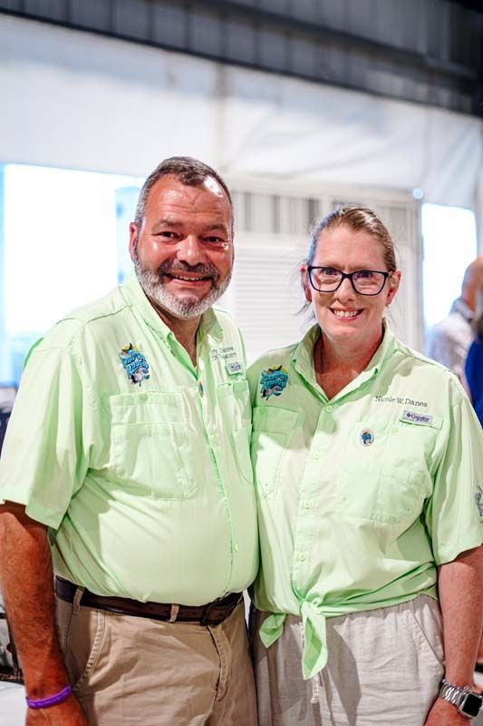 A man and a woman are posing for a picture together.