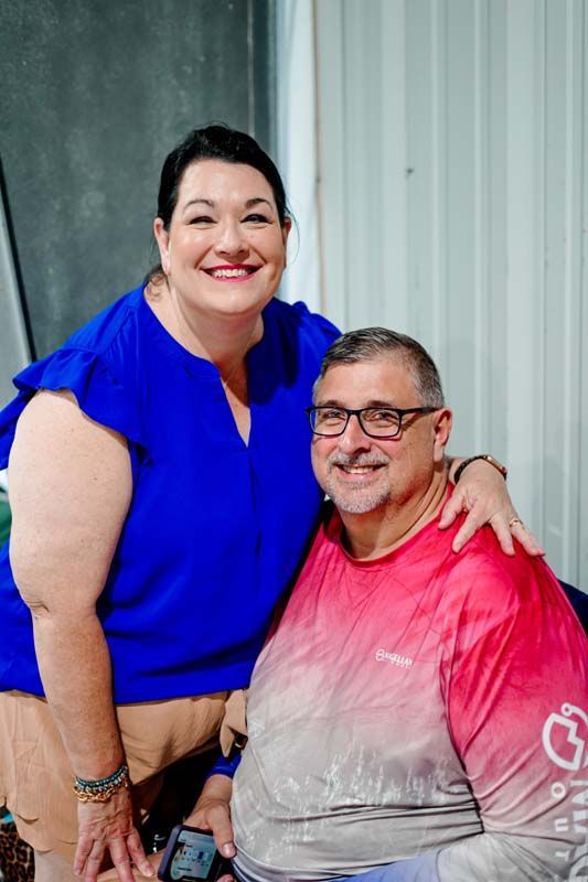 A man and a woman are posing for a picture together.
