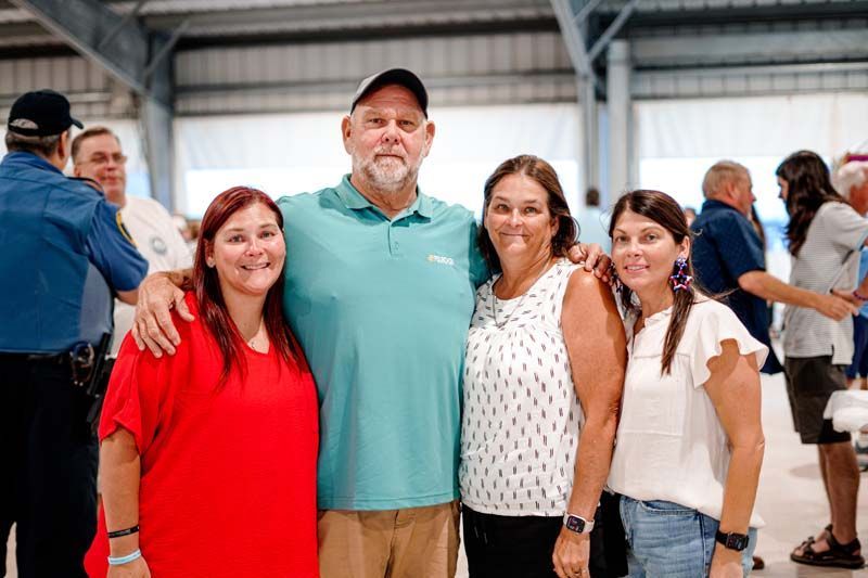 A group of people are posing for a picture together.