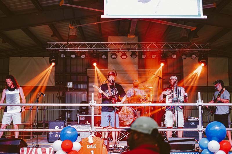A group of people are playing instruments on a stage.