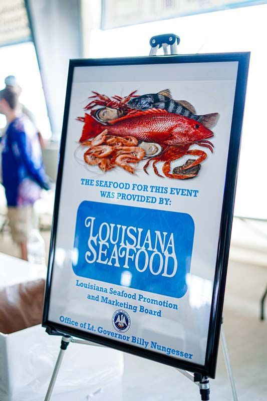 A sign that says louisiana seafood on it