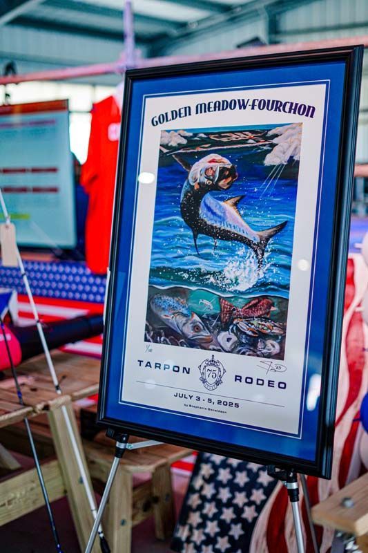 A framed picture of a fish jumping out of the water.