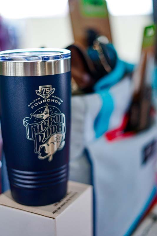A blue tumbler is sitting on top of a box.