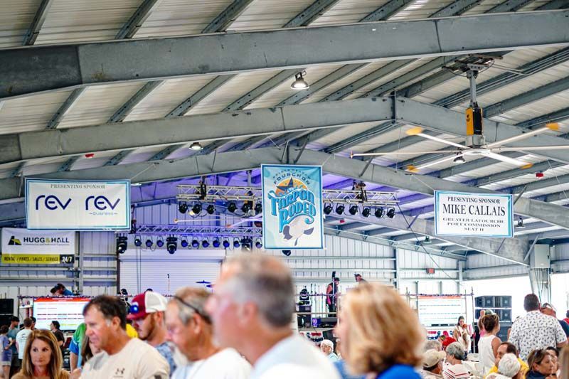 A group of people are standing in a large building.
