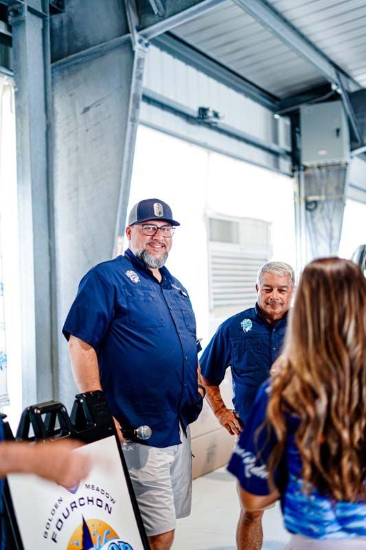 A group of people are standing next to each other in a building.