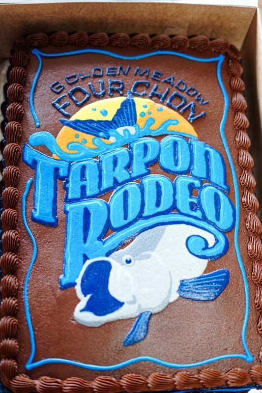 A brown cake with the words tarpon rodeo on it