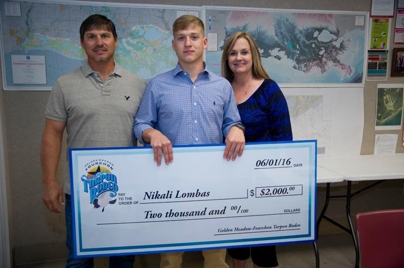 A man and a woman are holding a check that says two thousand and sixty