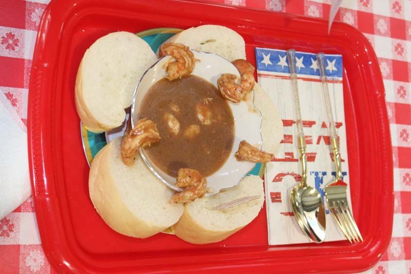 A tray of food with a napkin that says eat on it
