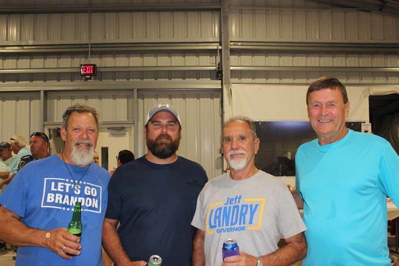 A group of men are standing next to each other in a building.
