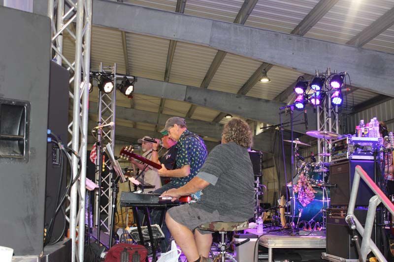 A group of people are playing instruments on a stage.