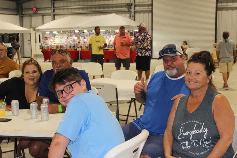 A group of people are sitting at tables in a room.