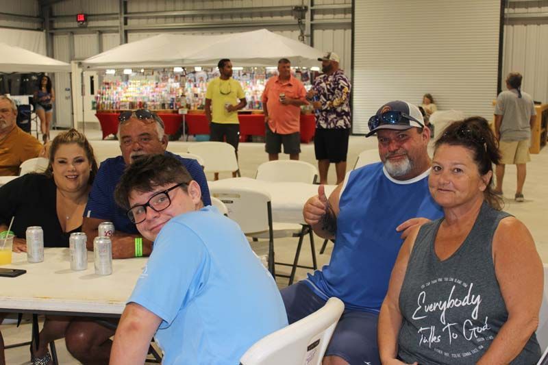A group of people are sitting at tables in a room.