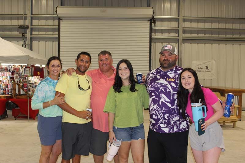 A group of people are posing for a picture in a building.
