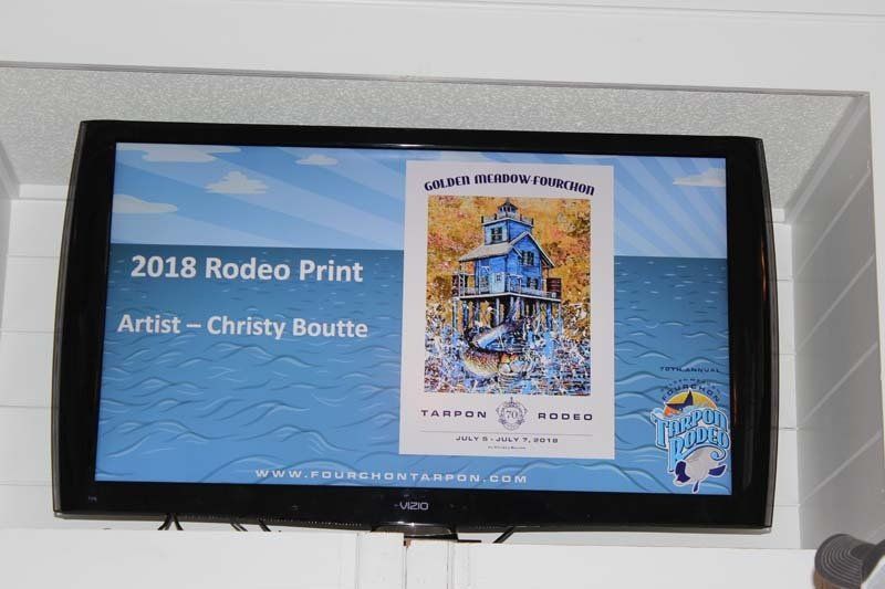A tv screen shows a rodeo print by christy boutie