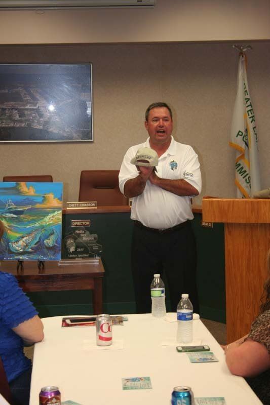 A man stands at a podium giving a presentation