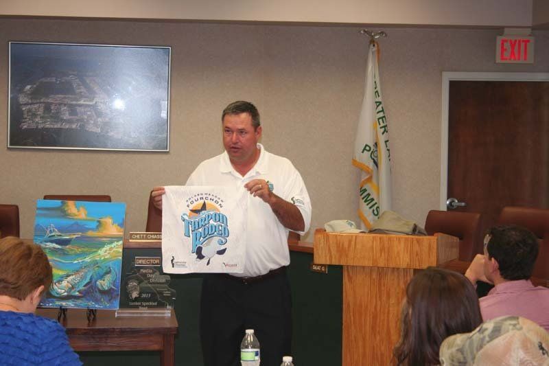 A man is giving a presentation in front of a group of people