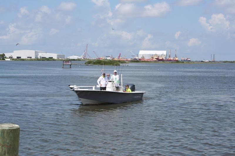 A group of people in a boat on a body of water