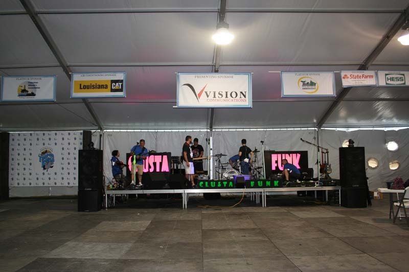 A stage with a sign that says vision on it