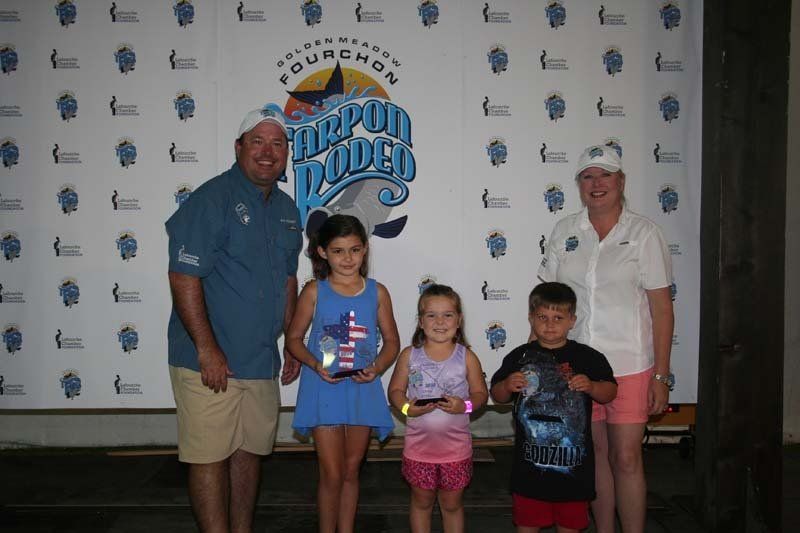 A group of people standing in front of a sign that says fourchan