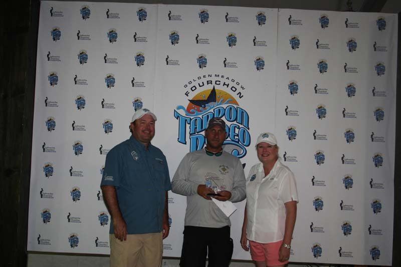 A group of people standing in front of a wall that says thunder bay