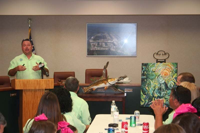 A man is giving a presentation to a group of people