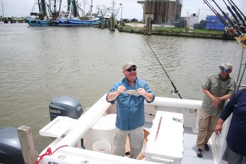 A man on a boat with a yamaha engine