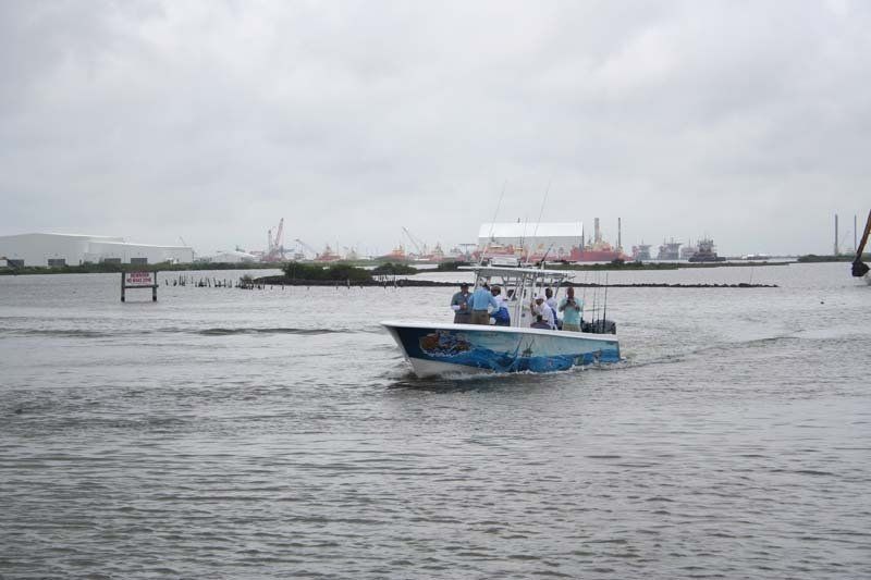 A boat is floating on top of a body of water.