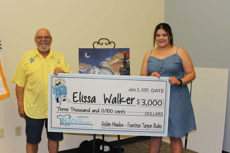 A man and a woman are holding a large check for elissa walker.